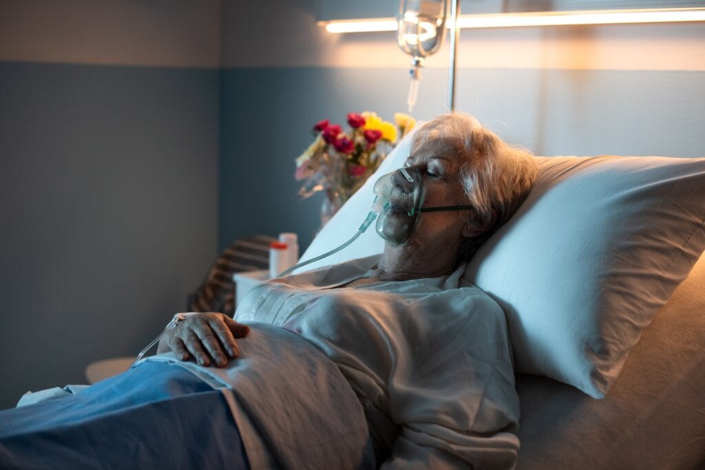 Senior woman lying in bed at the hospital